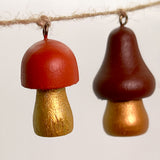 garland of hand painted wooden mushrooms on twine 