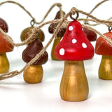 garland of hand painted wooden mushrooms on twine 